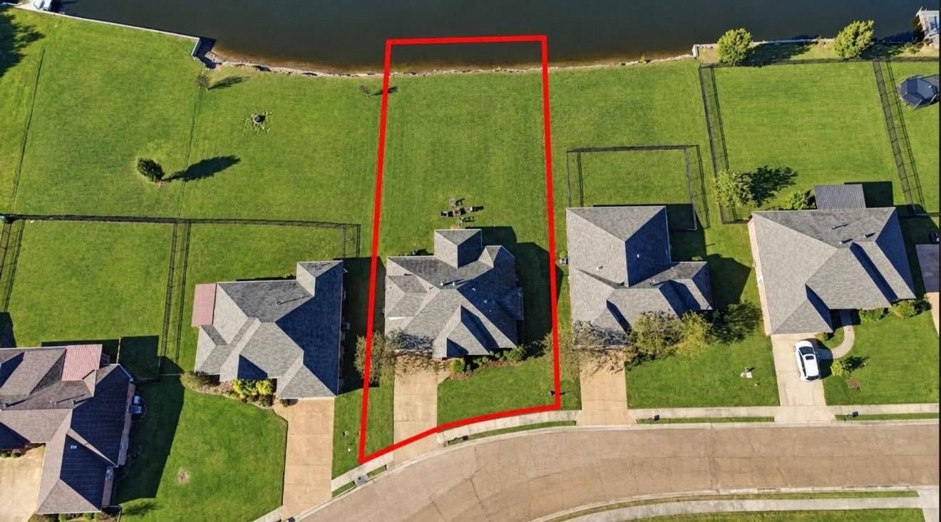 Aerial view of 145 Memory Lane showing the lakefront lot