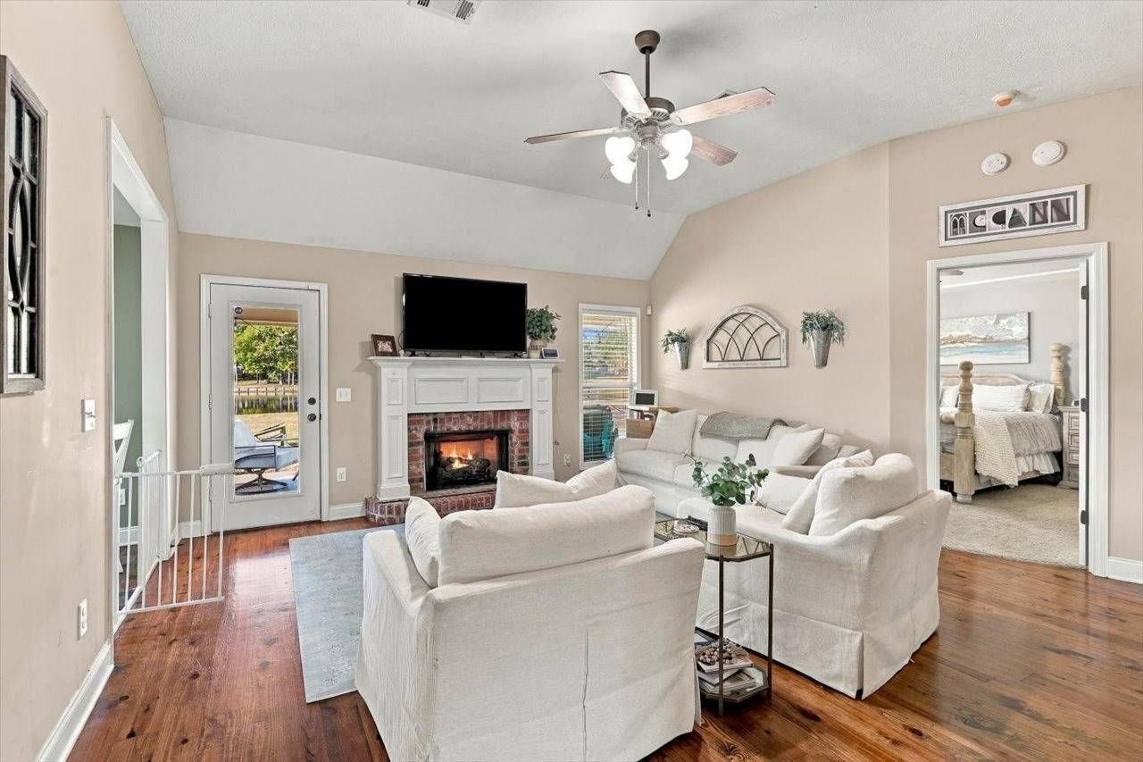 Living room with fireplace and vaulted ceiling
