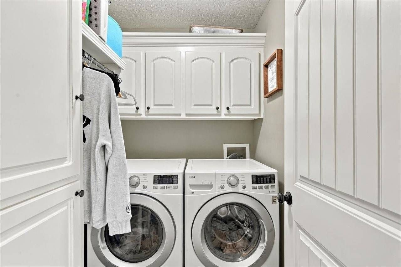 Laundry room with cabinets
