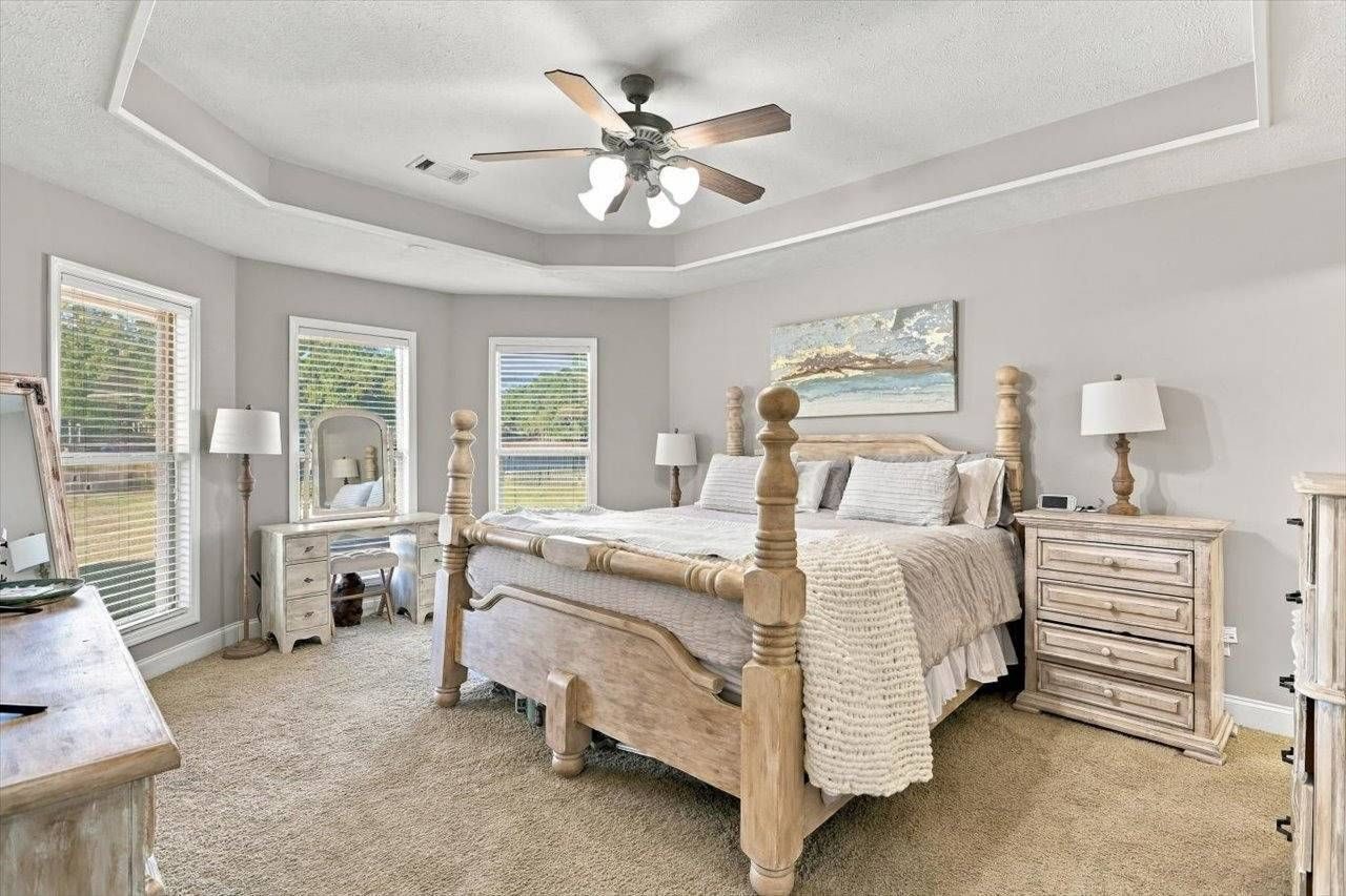 Primary bedroom with trey ceiling