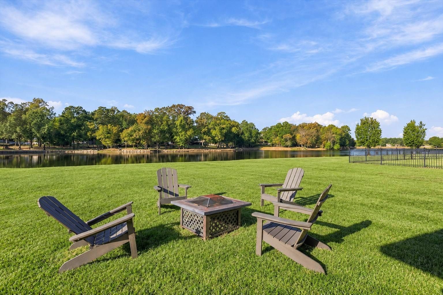 Backyard fire pit seating overlooking the lake